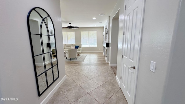 corridor with light tile patterned flooring