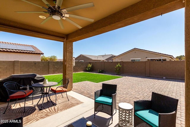 view of patio featuring ceiling fan and a fenced backyard