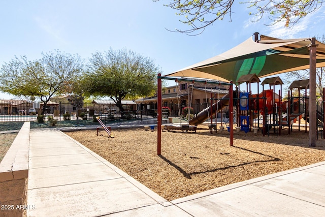 communal playground featuring fence