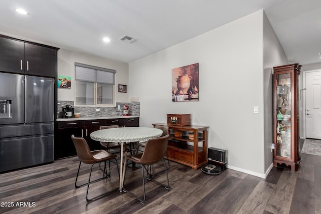 dining room featuring dark wood-style floors, recessed lighting, visible vents, and baseboards