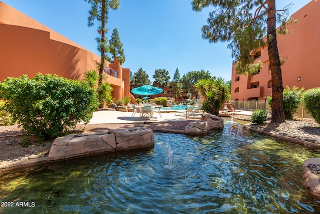 view of swimming pool with a patio