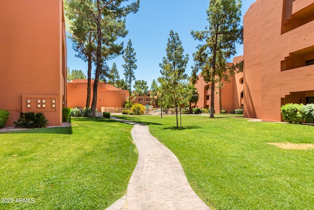 view of home's community with a lawn