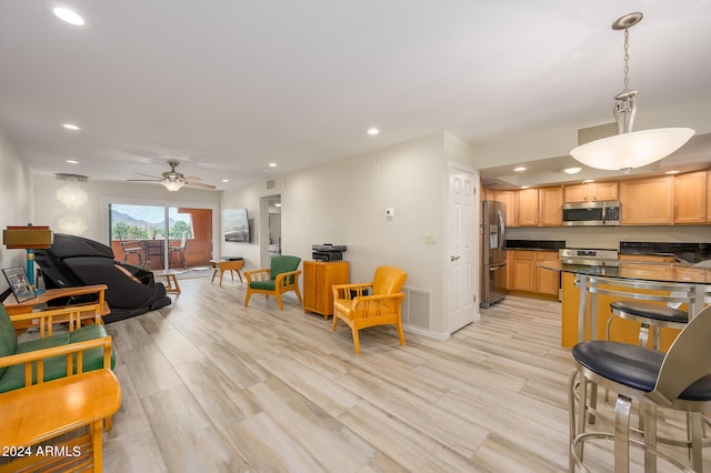 interior space with ceiling fan and light wood-type flooring