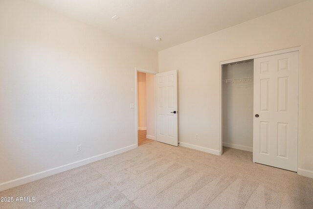 14771 W Columbus Ave, Goodyear, AZ 85395 - unfurnished bedroom with carpet floors, baseboards, and a closet