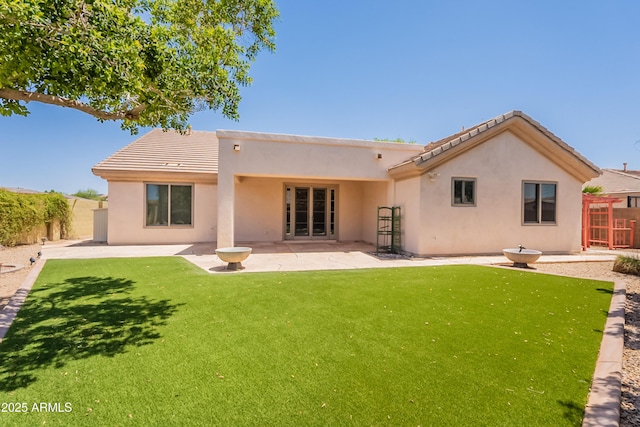 14771 W Columbus Ave, Goodyear, AZ 85395 - rear view of house with stucco siding, a patio, and a tile roof