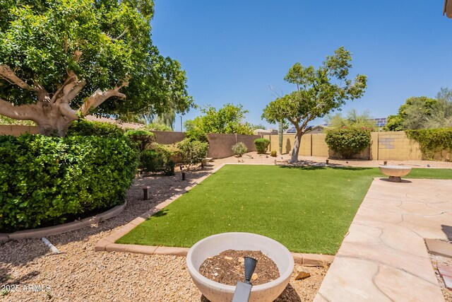 14771 W Columbus Ave, Goodyear, AZ 85395 - view of yard featuring a patio area