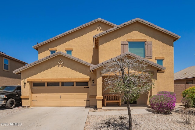 25218 W Carson Ct, Buckeye, AZ 85326 - view of property with a tiled roof, concrete driveway, and stucco siding