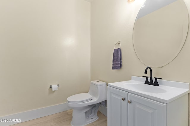 25218 W Carson Ct, Buckeye, AZ 85326 - half bath with vanity, wood finished floors, toilet, and baseboards