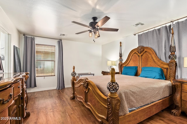 25218 W Carson Ct, Buckeye, AZ 85326 - bedroom with wood finished floors, baseboards, and a ceiling fan