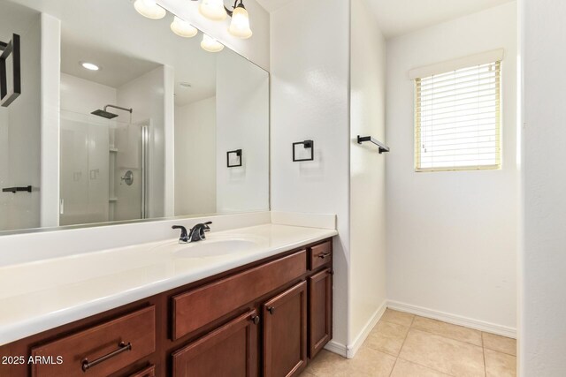 25218 W Carson Ct, Buckeye, AZ 85326 - bathroom with vanity, a shower stall, tile patterned floors, and baseboards