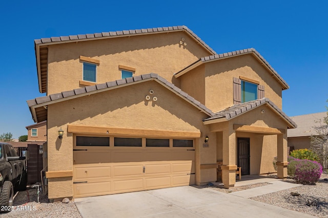25218 W Carson Ct, Buckeye, AZ 85326 - view of property featuring a tile roof, stucco siding, concrete driveway, and an attached garage