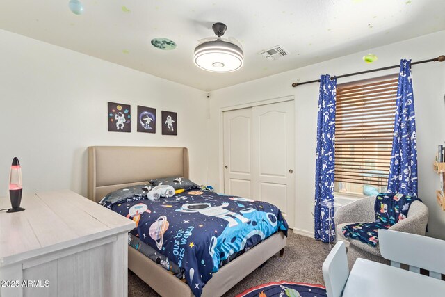 25218 W Carson Ct, Buckeye, AZ 85326 - carpeted bedroom featuring a closet and baseboards