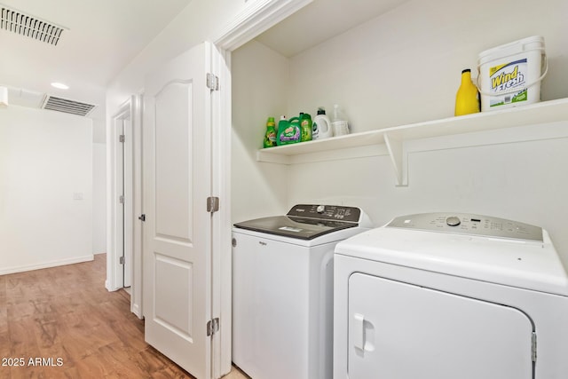 25218 W Carson Ct, Buckeye, AZ 85326 - washroom featuring independent washer and dryer and light wood-style floors