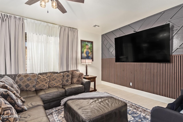 25218 W Carson Ct, Buckeye, AZ 85326 - living area featuring wood finished floors, ceiling fan, baseboards, and wooden walls