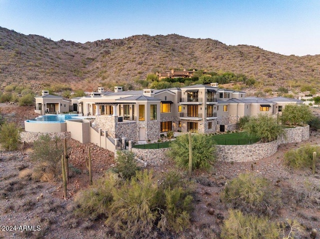 back of property featuring a mountain view