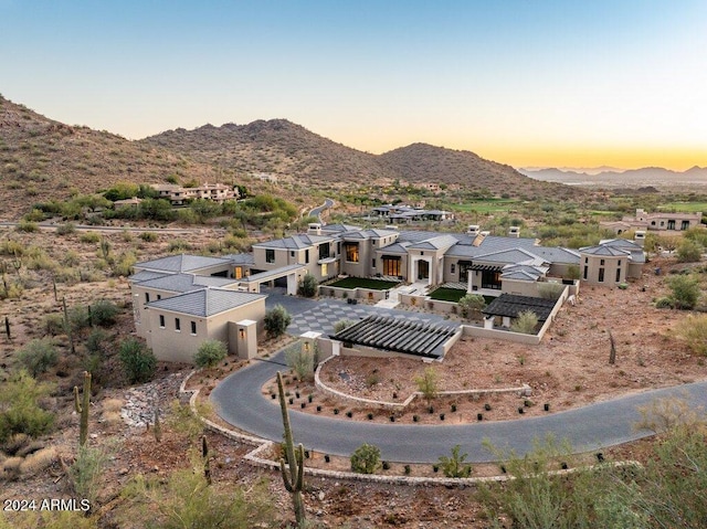 aerial view at dusk with a mountain view