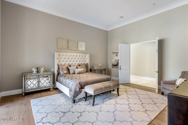 bedroom with hardwood / wood-style flooring and ornamental molding