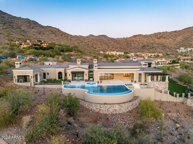 rear view of property with a mountain view