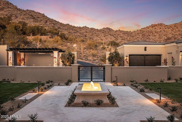 patio terrace at dusk with a mountain view