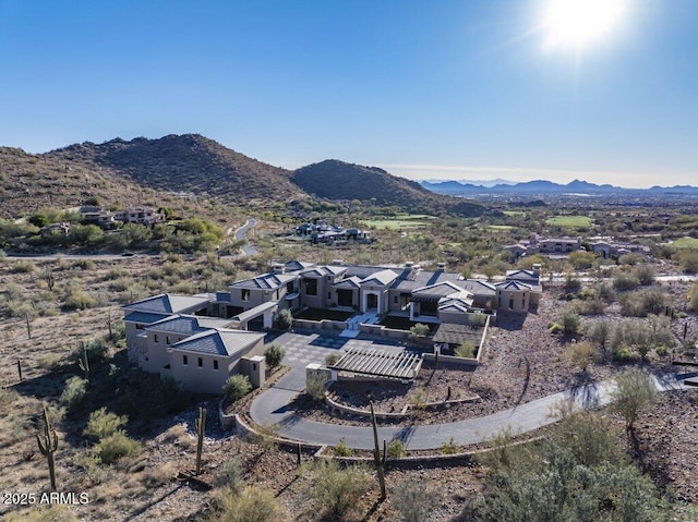 birds eye view of property with a mountain view