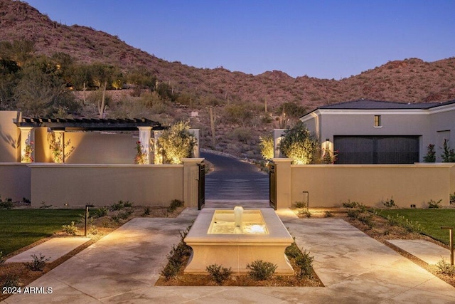 yard at dusk with a mountain view