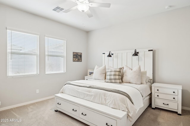 bedroom featuring light carpet, a ceiling fan, visible vents, and baseboards