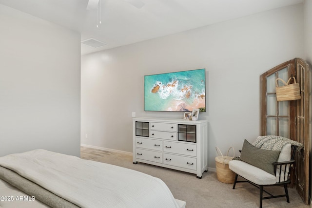 bedroom with light carpet, ceiling fan, visible vents, and baseboards