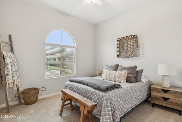 carpeted bedroom featuring ceiling fan and baseboards