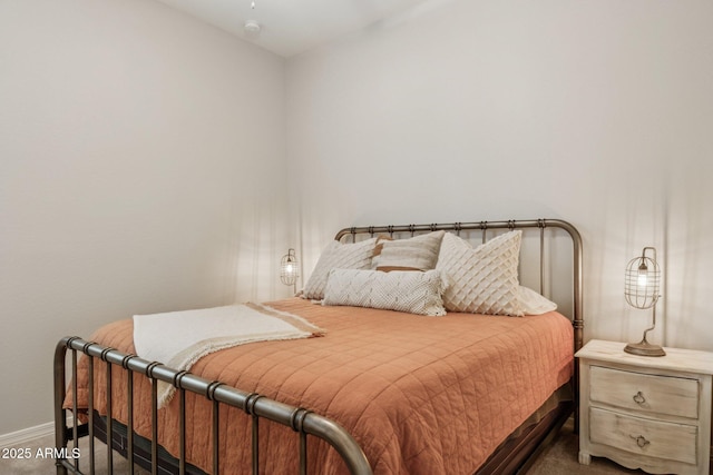 carpeted bedroom with baseboards