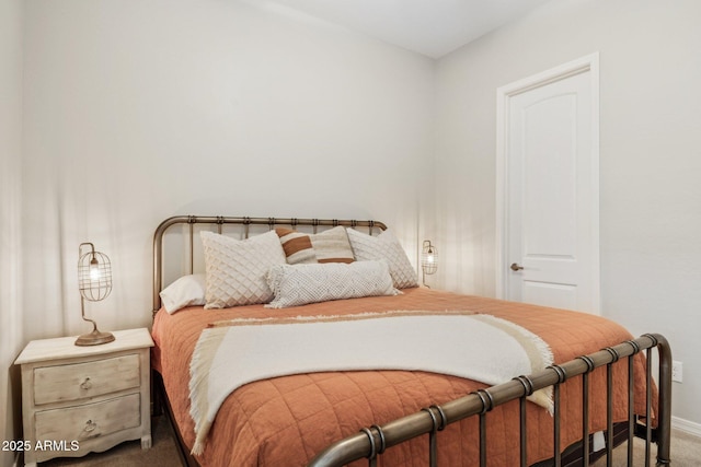carpeted bedroom with baseboards