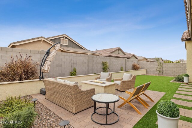 view of patio featuring a fenced backyard and a fire pit