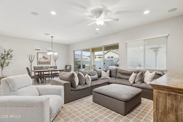living area with ceiling fan, visible vents, and recessed lighting