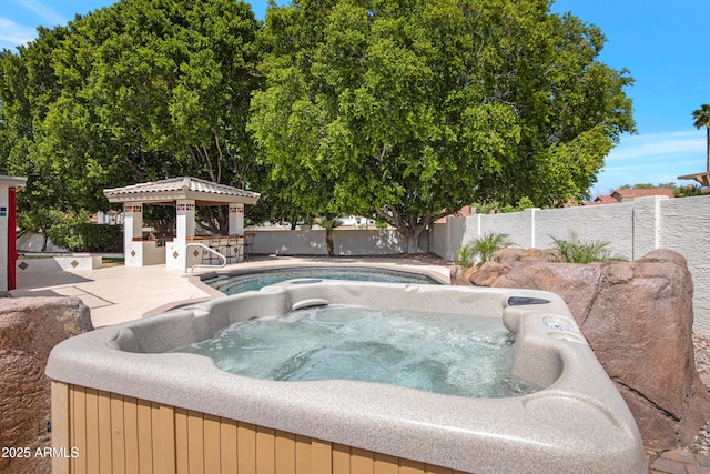 811 S Pearl Dr, Gilbert, AZ 85233 - view of swimming pool featuring fence and a hot tub