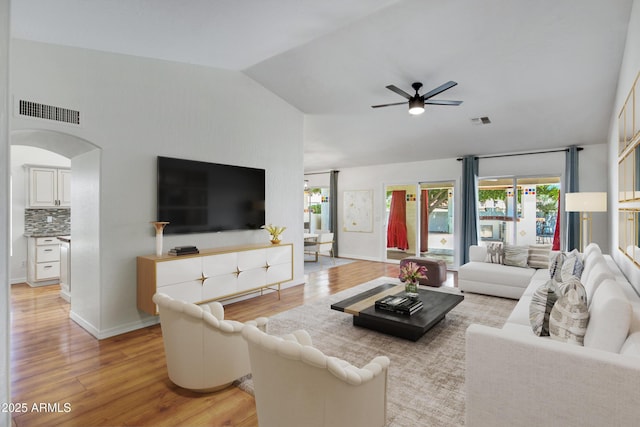 811 S Pearl Dr, Gilbert, AZ 85233 - living room with arched walkways, light wood-type flooring, visible vents, and ceiling fan