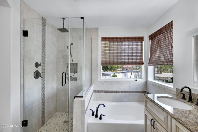 811 S Pearl Dr, Gilbert, AZ 85233 - full bath featuring a shower stall, a garden tub, and vanity