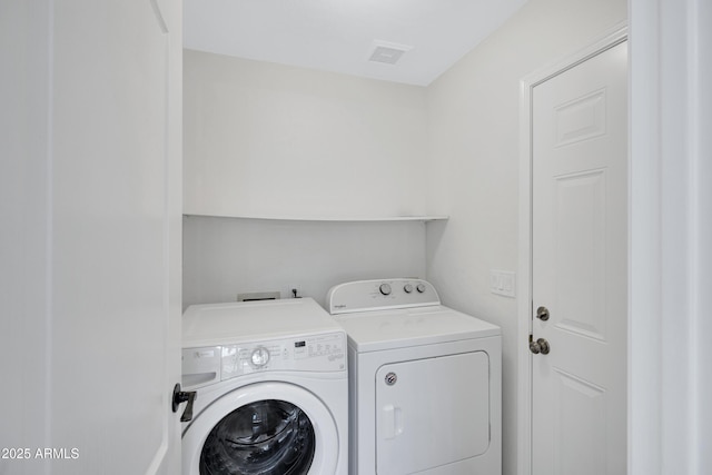 811 S Pearl Dr, Gilbert, AZ 85233 - laundry room with visible vents, washer and dryer, and laundry area