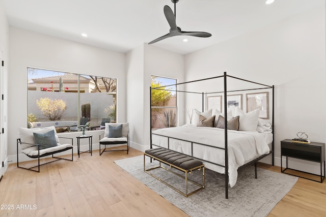 bedroom with light wood-type flooring and ceiling fan