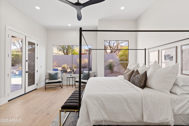 bedroom with french doors, ceiling fan, access to outside, and light hardwood / wood-style flooring