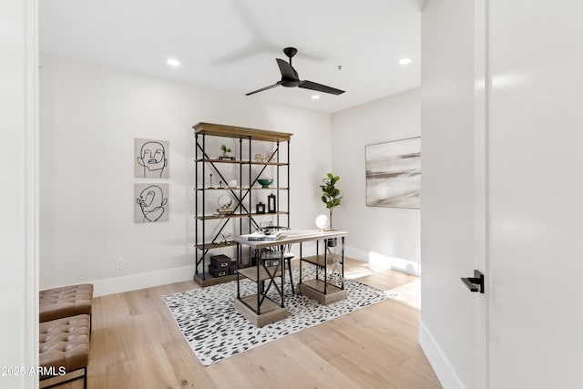 home office featuring ceiling fan and hardwood / wood-style flooring