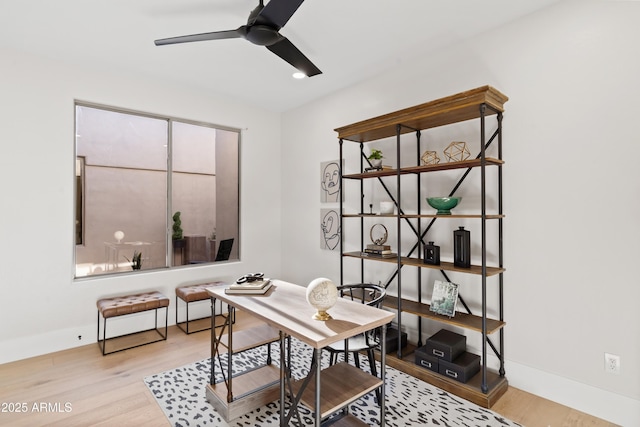 office featuring light wood-type flooring and ceiling fan