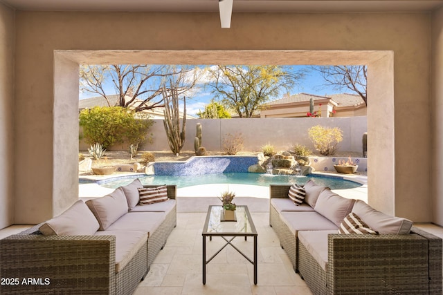 view of patio / terrace with pool water feature, a fenced in pool, and outdoor lounge area