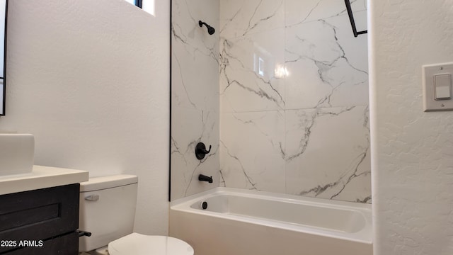full bath with a textured wall, vanity, tub / shower combination, and toilet