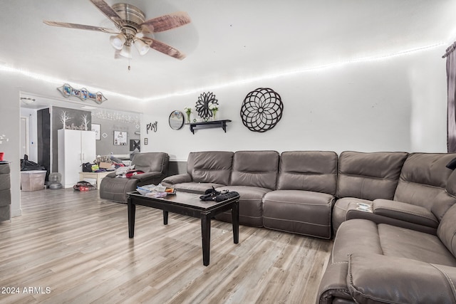 living room with ceiling fan and light hardwood / wood-style floors