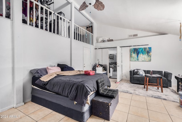 bedroom featuring high vaulted ceiling, light tile patterned floors, and ceiling fan