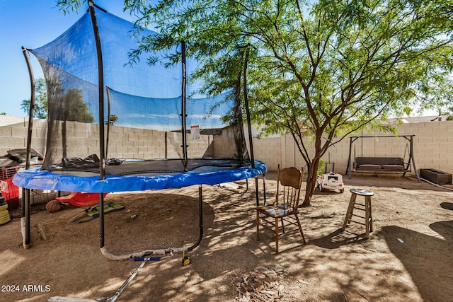 view of jungle gym featuring a trampoline