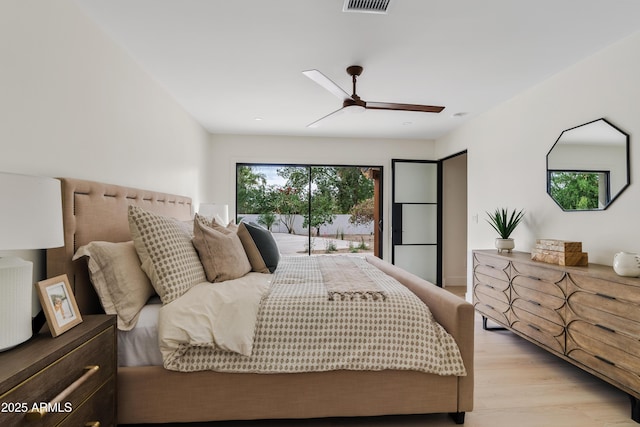 bedroom with access to exterior, light wood-style flooring, visible vents, and ceiling fan