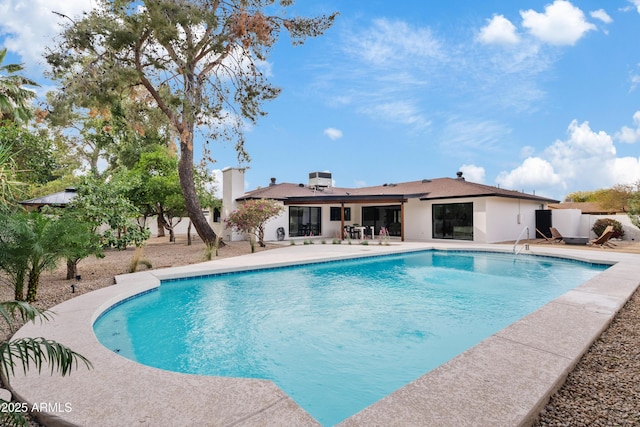 pool with a patio area