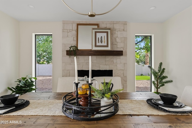 living room with hardwood / wood-style flooring and a fireplace