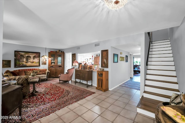 1924 W Belmont Ave, Phoenix, AZ 85021 - living area featuring a chandelier, visible vents, tile patterned flooring, and stairs