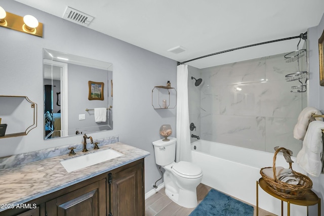 1924 W Belmont Ave, Phoenix, AZ 85021 - bathroom with visible vents, toilet, vanity, baseboards, and shower / bath combo